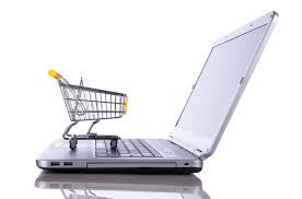 shopping cart on top of laptop